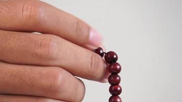 hand holding a red beads video