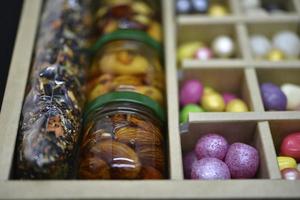 A gift set of sweets and nuts in honey. Delicious sweets. Colorful sweets. photo