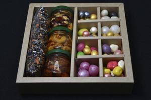 A gift set of sweets and nuts in honey. Delicious sweets. Colorful sweets. photo