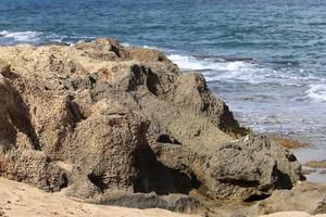 Rocky shore of the Mediterranean Sea in northern Israel. photo