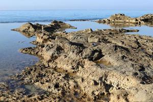 Rocky shore of the Mediterranean Sea in northern Israel. photo