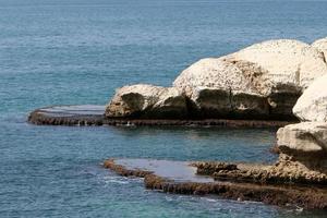 Rocky shore of the Mediterranean Sea in northern Israel. photo