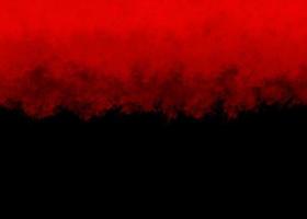 rojo color polvo explosión en negro fondo.rojo polvo partículas salpicaduras foto
