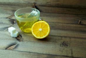 Green tea with lemon and sugar. photo