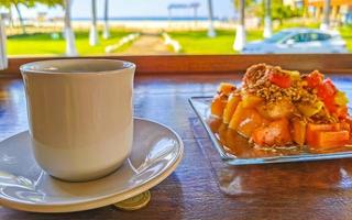 Breakfast at restaurant fruits with oatmeal orange juice and coffee. photo