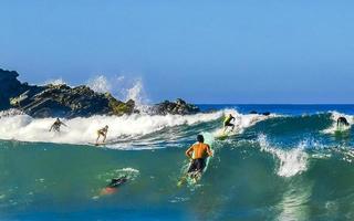 Puerto Escondido Oaxaca Mexico 2023 Surfer surfing on surfboard on high waves in Puerto Escondido Mexico. photo