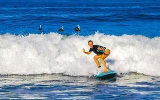 Puerto Escondido Oaxaca Mexico 2023 Surfer surfing on surfboard on high waves in Puerto Escondido Mexico. photo