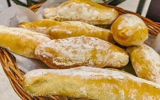 Rolls baguettes cakes and other pastries in Chedraui Supermarket Mexico. photo