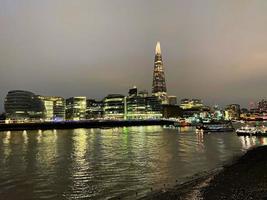 The River Thames at night with reflection photo