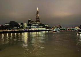 The River Thames at night with reflection photo