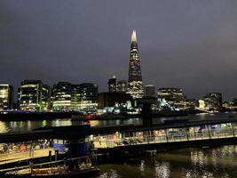 The River Thames at night with reflection photo