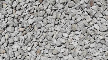 Crushed stone aggregate texture background and backdrop material design. photo