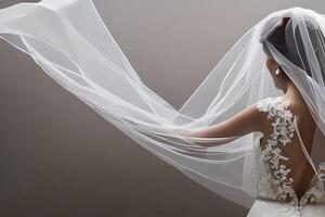 Close up detail a bride from behind in a white wedding dress. photo