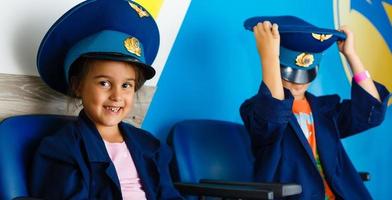 Happy kids playing airplane. Portrait of children photo