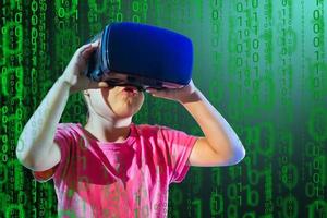 Young girl experiencing VR headset game on colorful background. Child using a gaming gadget for virtual reality. Futuristic goggles at young age. Virtual technology photo