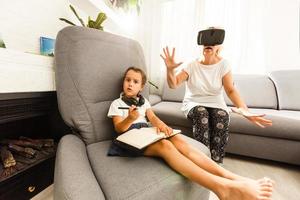 Digital composite of Grandparents wearing VR Virtual Reality Headset with Interface with Child photo