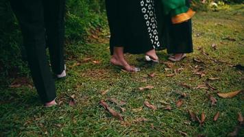 Muslim women put their belongings in a garden while relaxing video