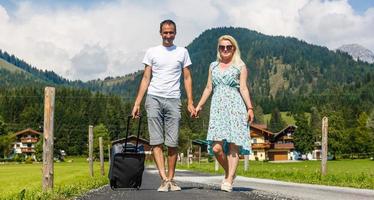 Happy smiling couple in love in the mountains photo