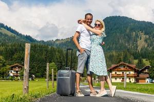 Happy smiling couple in love in the mountains photo