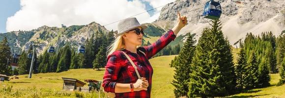 Young Woman blonde enjoying mountains landscape Travel Lifestyle happy emotions concept adventure outdoor active vacations in Norway girl tourist walking