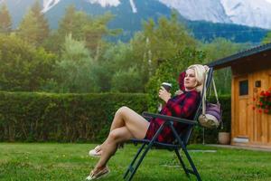 A woman looking at the mountains. Europe, Germany, Bavaria photo