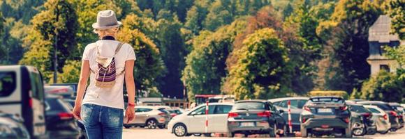 woman walking with car keys in the underground parking of the castle photo