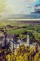 Beautiful aerial view of Neuschwanstein castle in autumn season. Palace situated in Bavaria, Germany. Neuschwanstein castle one of the most popular palace and travel destination in Europe and world. photo