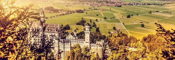 Beautiful aerial view of Neuschwanstein castle in autumn season. Palace situated in Bavaria, Germany. Neuschwanstein castle one of the most popular palace and travel destination in Europe and world. photo