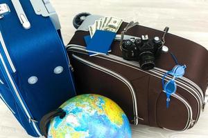 Different suitcases on tile floor photo