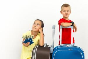 A happy family with their suitcases on a white background photo