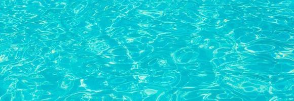 surface of blue swimming pool,background of water in swimming pool. photo