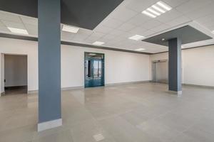 panorama view in empty modern hall with columns, doors and panoramic windows photo