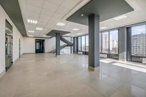 empty modern hall room with columns, doors and panoramic windows photo