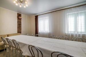 large table with chairs in the banquet hall photo