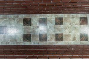 stone and ceramic floor tiles texture in corridor, view from above photo