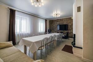 large table with chairs in the banquet hall photo