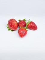 strawberries on a wooden white background photo