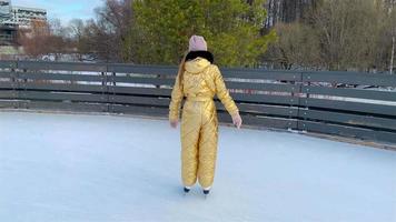 Young girl at outdoor skating rink video