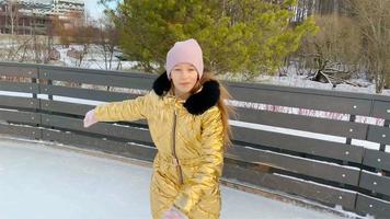 Young girl at outdoor skating rink video