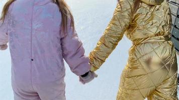 Young girls together in outdoor winter activities video