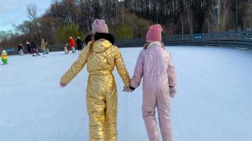 Young girls together in outdoor winter activities video