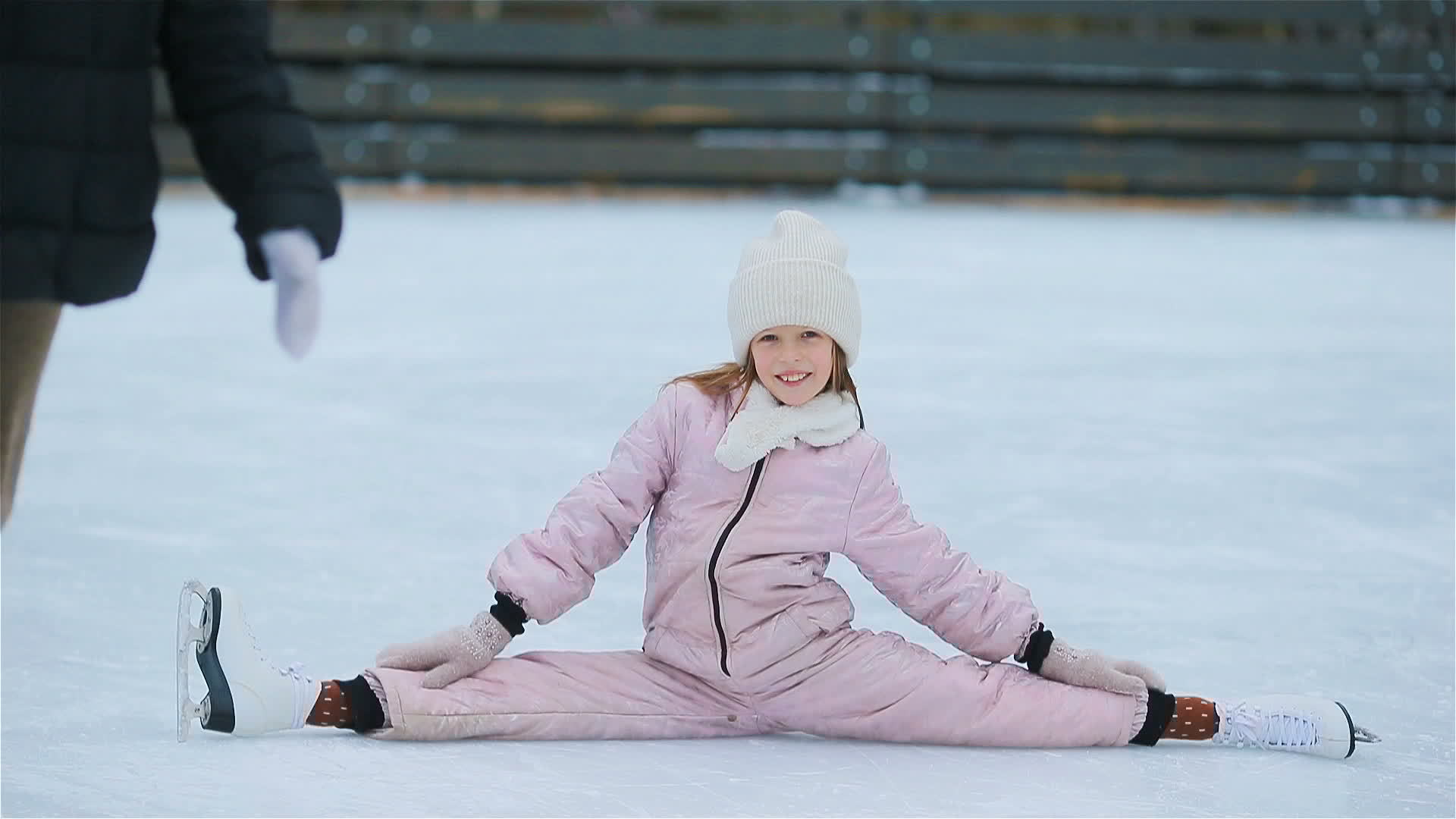 Young girl does splits in outdoor ice skating rink 20898486 Stock Video