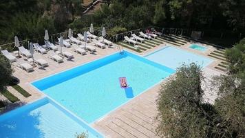 Aerial view of crisp blue pool at resort video