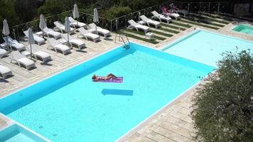 Aerial view of crisp blue pool at resort video