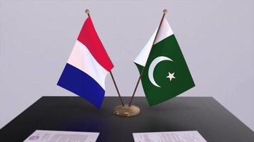 Pakistan et France nationale drapeaux sur table dans diplomatique conférence chambre. politique traiter accord video