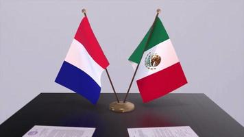 Mexico and France national flags on table in diplomatic conference room. Politics deal agreement video