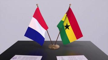 Ghana and France national flags on table in diplomatic conference room. Politics deal agreement video
