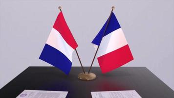 France national flags on table in diplomatic conference room. Politics deal agreement video