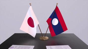 Laos and Japan national flags, political deal, diplomatic meeting. Politics and business animation video