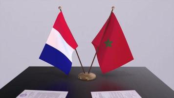 Morocco and France national flags on table in diplomatic conference room. Politics deal agreement video